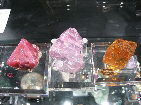 Tanzanian Spinel, Burmese Spinel, and Brazilian Imperial Topaz rough and cut photo image